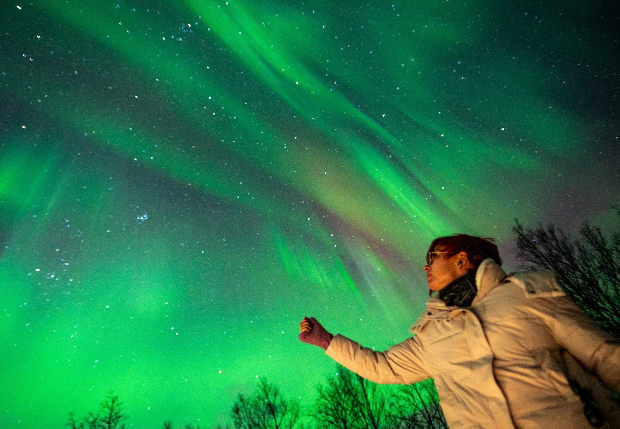 Aurora borealis reflecting on Arctic Ocean, Teriberka Russia
